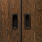 Regent Recessed Medium Pull - Bronze door handle on wooden cabinet, showcasing a sleek recessed design.