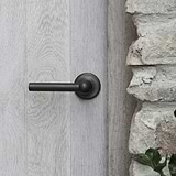 bronze harper mortice door handle on wooden door