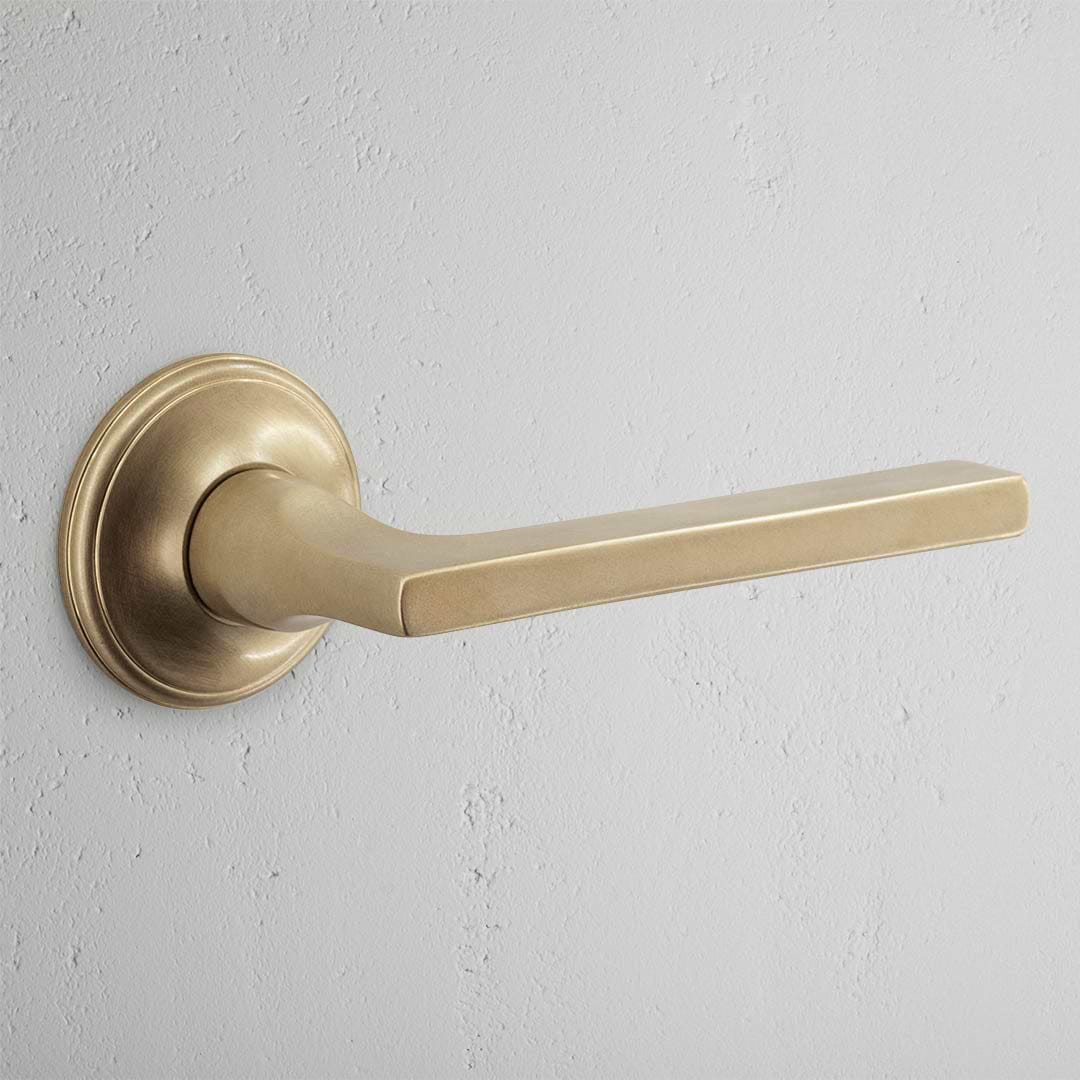 Clayton Sprung Door Handle – Antique Brass