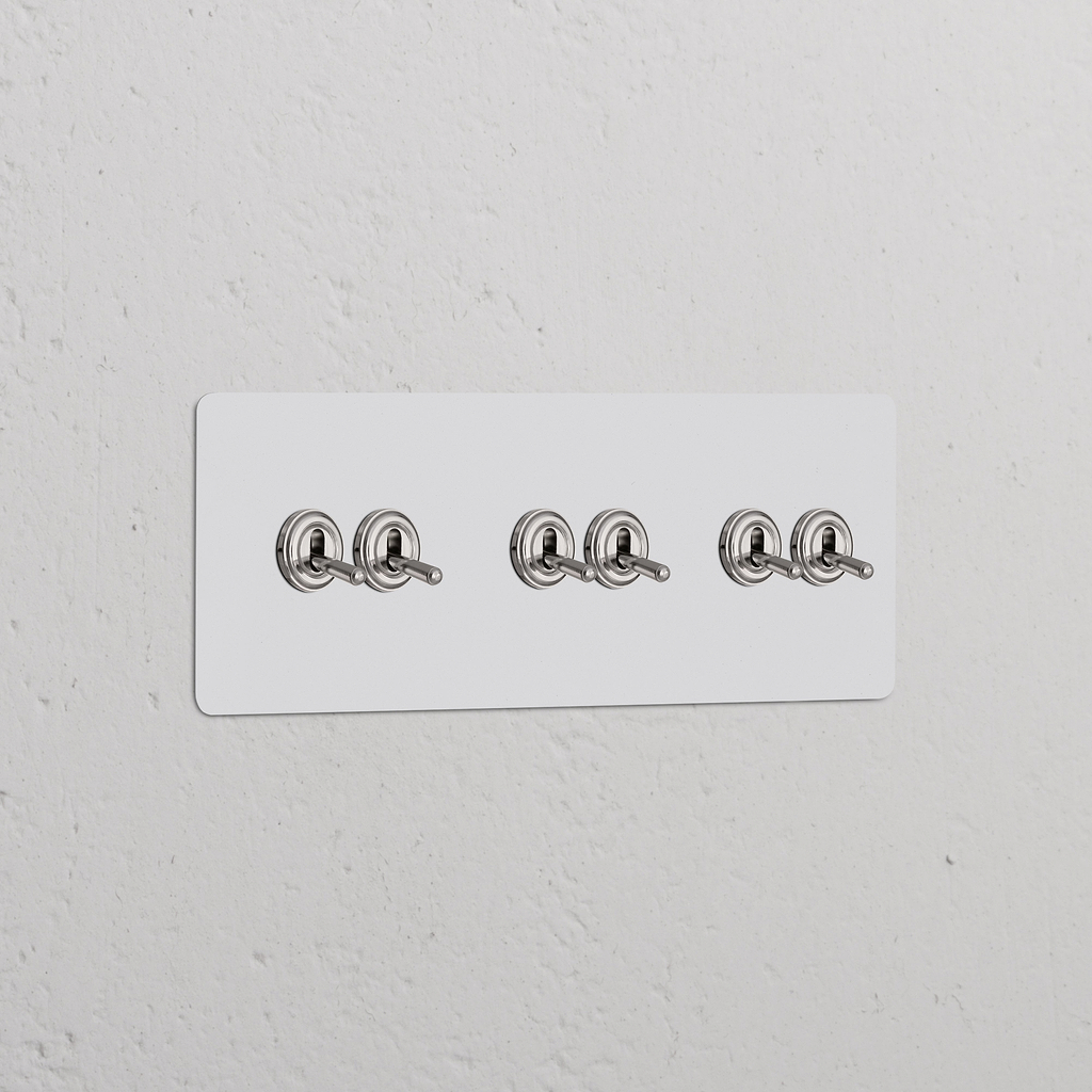 Dreifachrahmen mit 6x Kipphebelschalter – Lackierbar + Poliertes Nickel