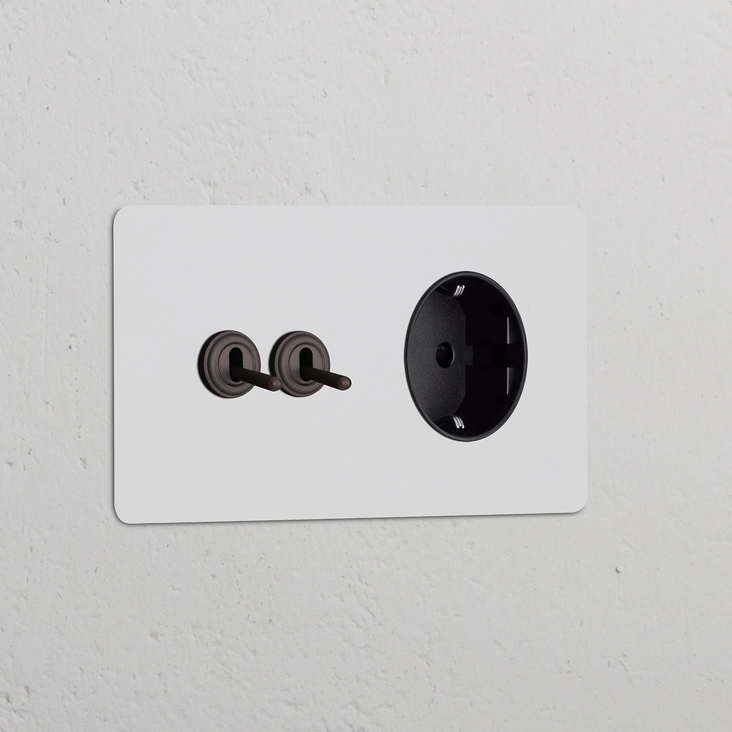 Zweifachrahmen mit 2x Kipphebelschalter + Schuko Typ F runder Steckdoseneinsatz – Lackierbar + Bronze + Schwarz