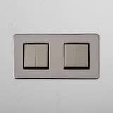 Quad-Control-Lichtschalter mit hoher Kapazität: Vier-Wege-Wippschalter – Poliertes Nickel + Schwarz – auf weißem Hintergrund