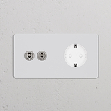 Zweifachrahmen mit 2x Kipphebelschalter + Schuko Typ F, lackierbar, poliertes Nickel und Weiß auf Wand montiert.