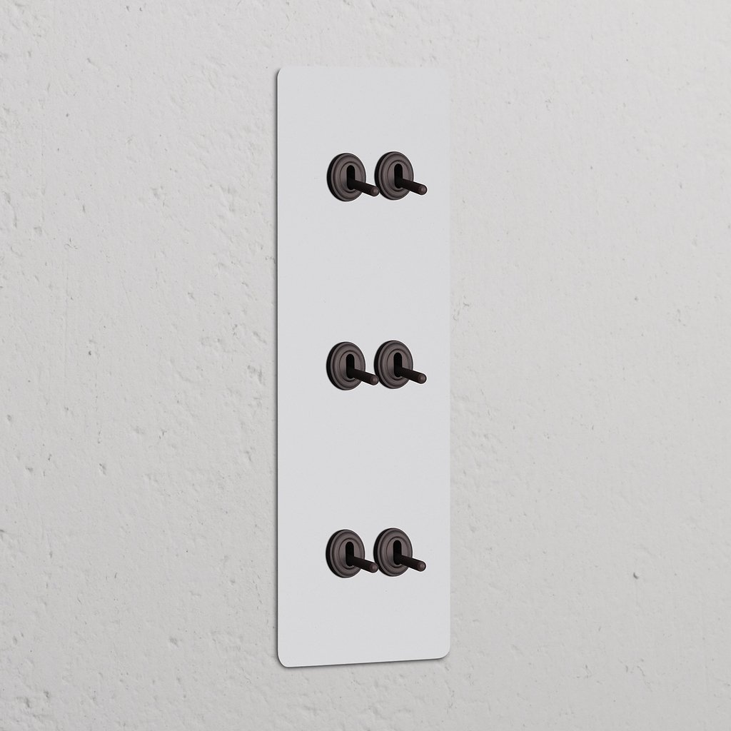 Kipphebelschalter 6x in vertikalem Dreifachrahmen – Lackierbar + Bronze