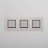 Lichtsteuerschalter mit hoher Kapazität: Poliertes Nickel + Schwarz – 3x-Wippschalter – auf weißem Hintergrund