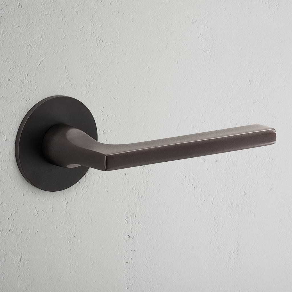 Manilla para puertas Clayton con roseta (sin muelle) - Bronce