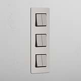 Interruptor para control de la luz de súper capacidad en diseño vertical: Interruptor triple de balancín x6 en níquel pulido y negro vertical