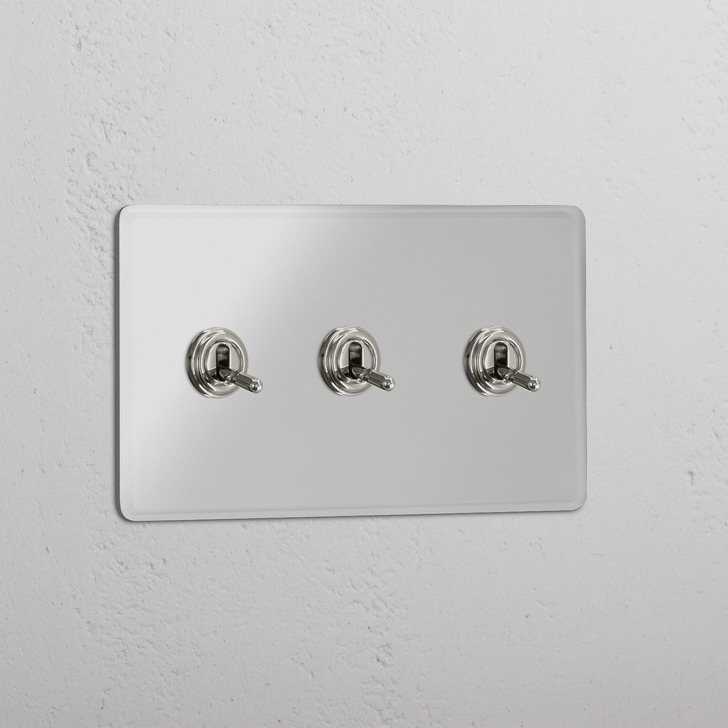 Interruptor triple de palanca en níquel pulido y traslúcido - Accesorio funcional para control de luces