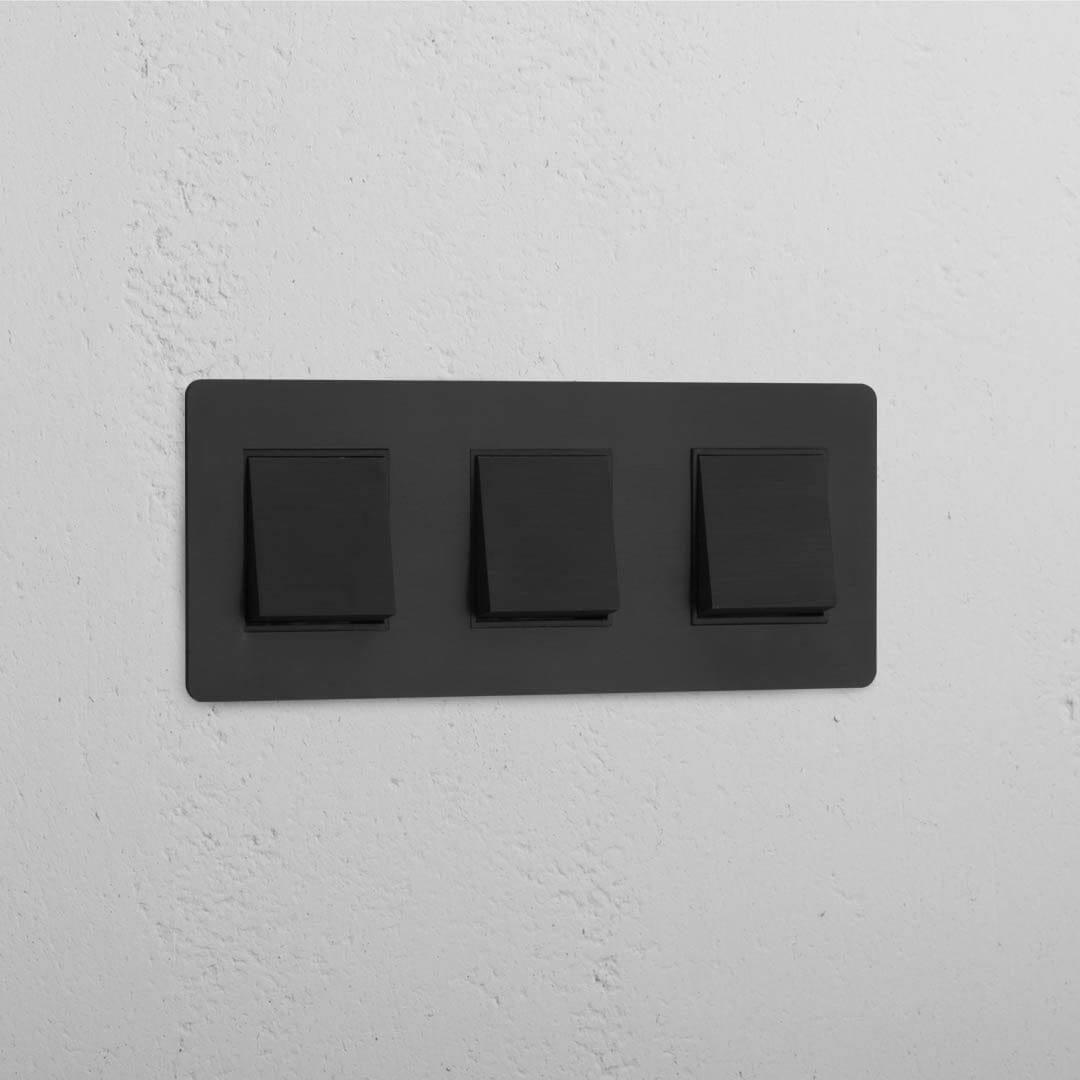 Interruptor triple de balancín en bronce y negro de alto rendimiento - Solución para el manejo de luces