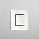Interruptor para control de la luz posición central: Interruptor individual de balancín en níquel pulido y blanco (Cent.)