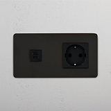 Módulo doble USB 30W y Schuko en bronce y negro, solución de carga óptima, sobre fondo blanco