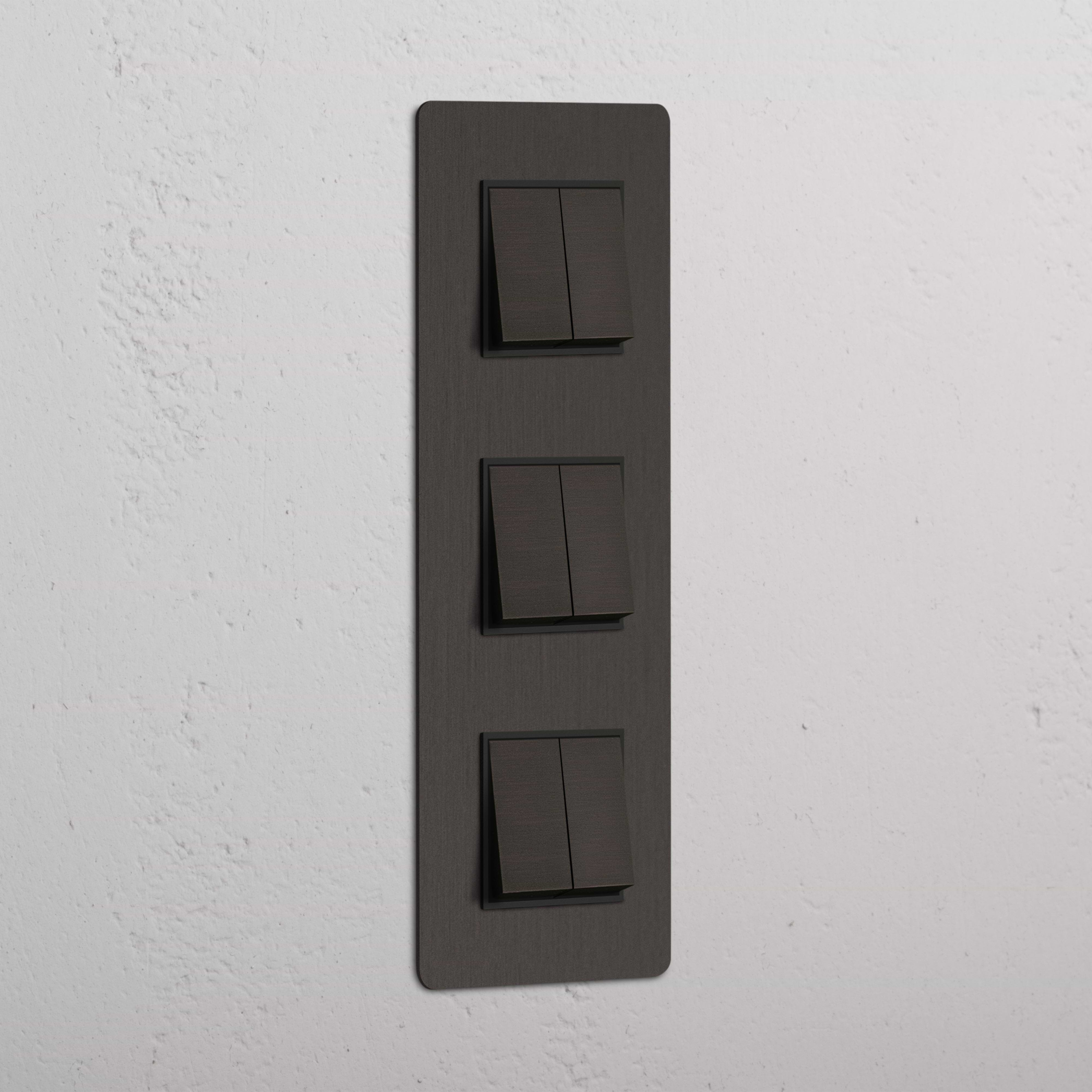 Interruptor triple de balancín en bronce y negro con diseño vertical, de alta capacidad - Solución avanzada para control de luces