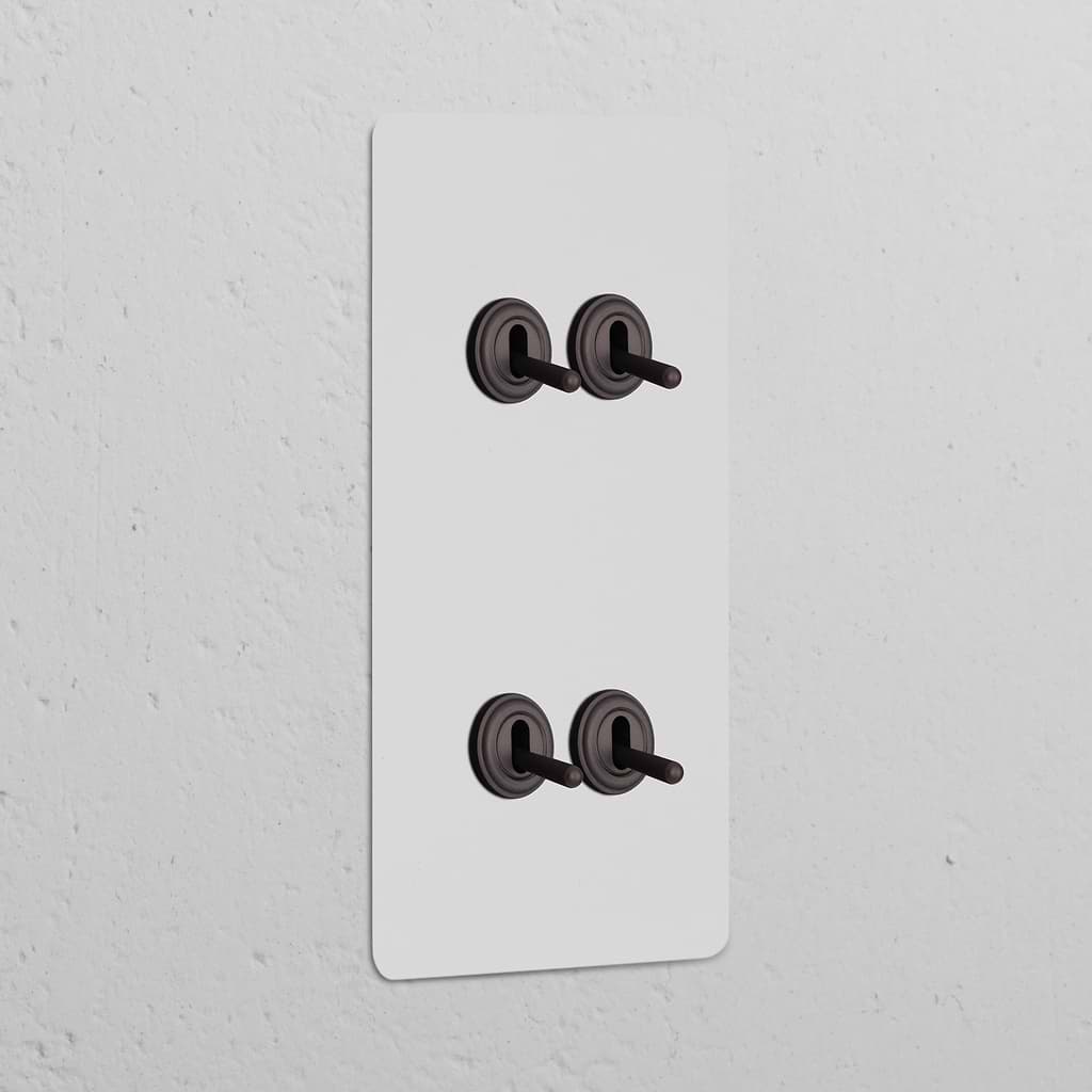 Interruptor conmutador de palanca x4 vertical (marco doble) - Pintable y bronce 
