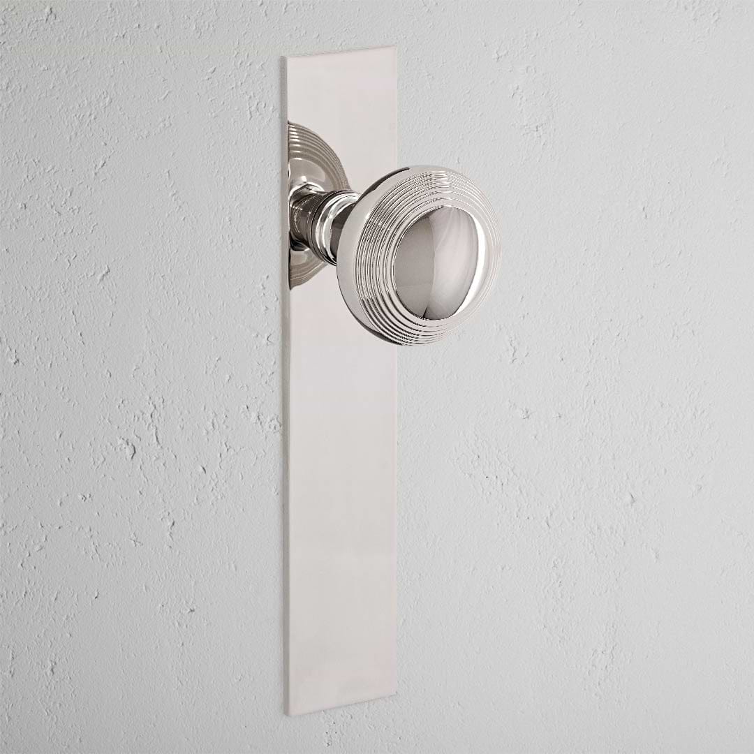 Pomo para puertas Poplar con placa larga (fijo) - Níquel pulido