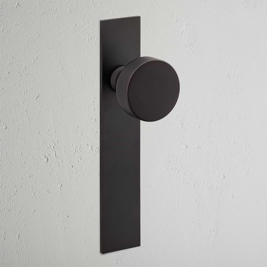 Pomo para puertas Onslow con placa larga (fijo) - Bronce
