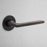 Manilla para puertas Clayton con roseta plana (sin muelle) - Bronce