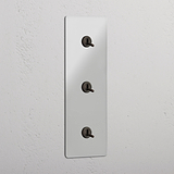 Interruptor triple de palanca en bronce y traslúcido con diseño vertical - Sistema de control de luces fácil de usar