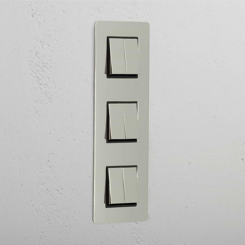 Interruptor para control de la luz de súper capacidad en diseño vertical: Interruptor triple de balancín x6 en níquel pulido y negro vertical