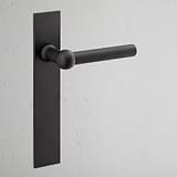 Manilla para puertas Harper con placa larga (fija) - Bronce