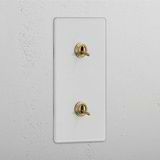 Interruptor doble de palanca en latón antiguo y traslúcido, diseño vertical - Accesorio elegante para control de luces