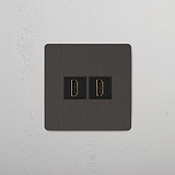 Módulo individual HDMI de calidad superior, en bronce y negro con puertos dobles sobre fondo blanco