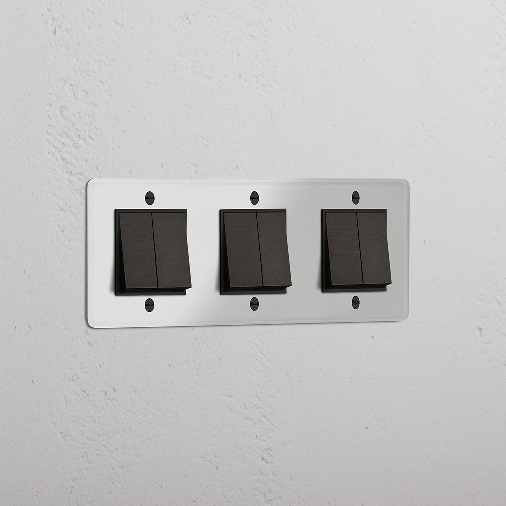 Interruptor triple de balancín en bronce y traslúcido con negro de seis posiciones - Solución moderna de control de luz