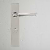 Manilla para puertas Digby con placa larga (con muelle) y sistema giratorio - Níquel pulido