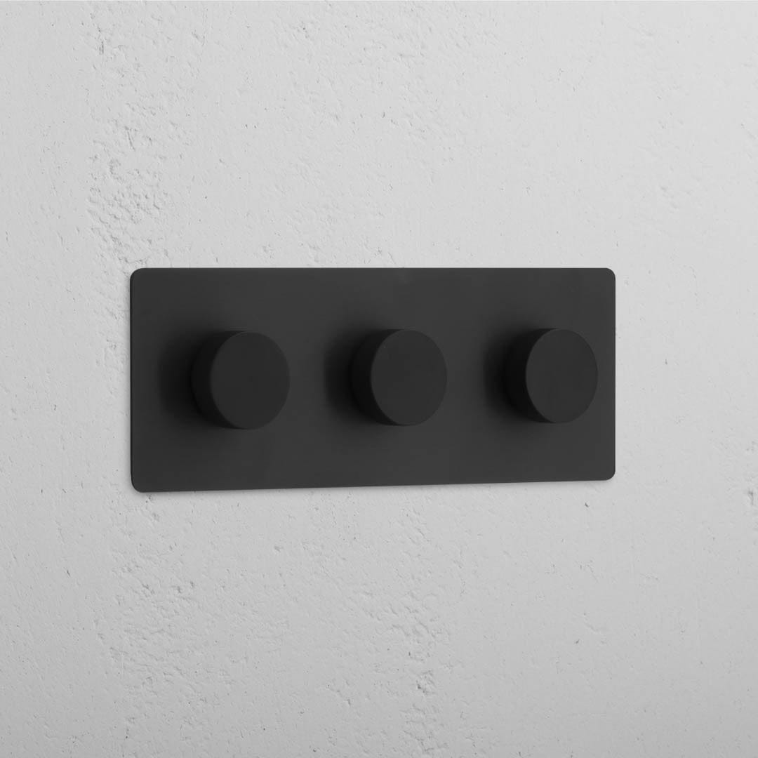 Interruptor triple con regulador de luz en bronce y negro - Herramienta moderna para manejar luces