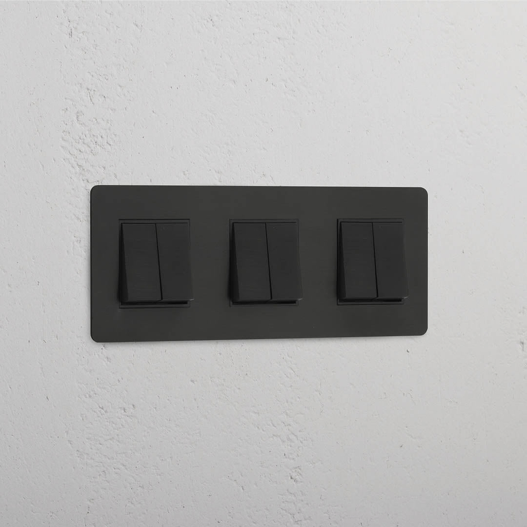 Interruptor triple de balancín en bronce y negro con seis posiciones - Accesorio completo para el manejo de luces