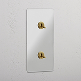 Interruptor doble de palanca en latón antiguo y traslúcido, diseño vertical - Accesorio elegante para control de luces