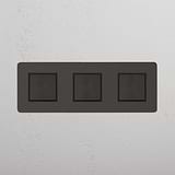 Seamless Light Control with Bronze Black Triple Rocker Switch on White Background