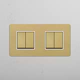 Four Position Double Rocker Switch in Antique Brass White on White Background