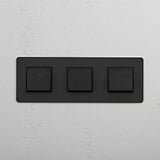 Seamless Light Control with Bronze Black Triple Rocker Switch on White Background