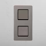 Dual Vertical Light Control Switch on White Background: Polished Nickel Black Double 2x Vertical Rocker Switch