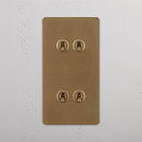 Vertical Design Double Toggle Switch, Four-Switch, Antique Brass on White Background