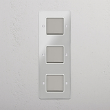 Vertical Orientation Triple Rocker Switch in Clear Polished Nickel White - Space-Saving Light Control Solution on White Background