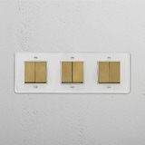 Comprehensive Light Management Tool: Six-Position Triple Rocker Switch in Clear Antique Brass White on White Background
