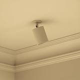 Luminaire blanc 'Brompton Spots 70mm - À peindre' sur plafond beige avec moulure couronnée, idéal pour peinture personnalisée.