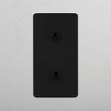 Double Vertical Toggle Switch in Bronze on White Background