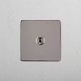 Retractive Light Toggle Switch: Polished Nickel Single Toggle Switch (Ret) on White Background