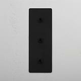 User-Friendly Triple Vertical Toggle Switch in Bronze on White Background