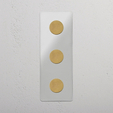 Vertical Triple Dimmer Switch in Clear Antique Brass - Superior Light Adjustment Accessory on White Background