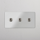 Functional Triple Toggle Switch in Clear Polished Nickel for Light Control on White Background