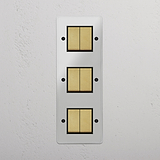 Six-Position Vertical Triple Rocker Switch in Clear Antique Brass Black - Advanced Light Control Accessory on White Background