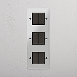 Advanced Vertical Six-Position Triple Rocker Switch in Clear Bronze Black for Lighting Control on White Background