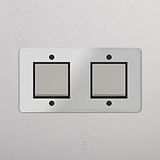 Sleek Double Rocker Switch in Clear Polished Nickel Black for Lighting Control on White Background