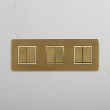 High-Capacity Triple Rocker Switch in Antique Brass White for Modern Living on White Background