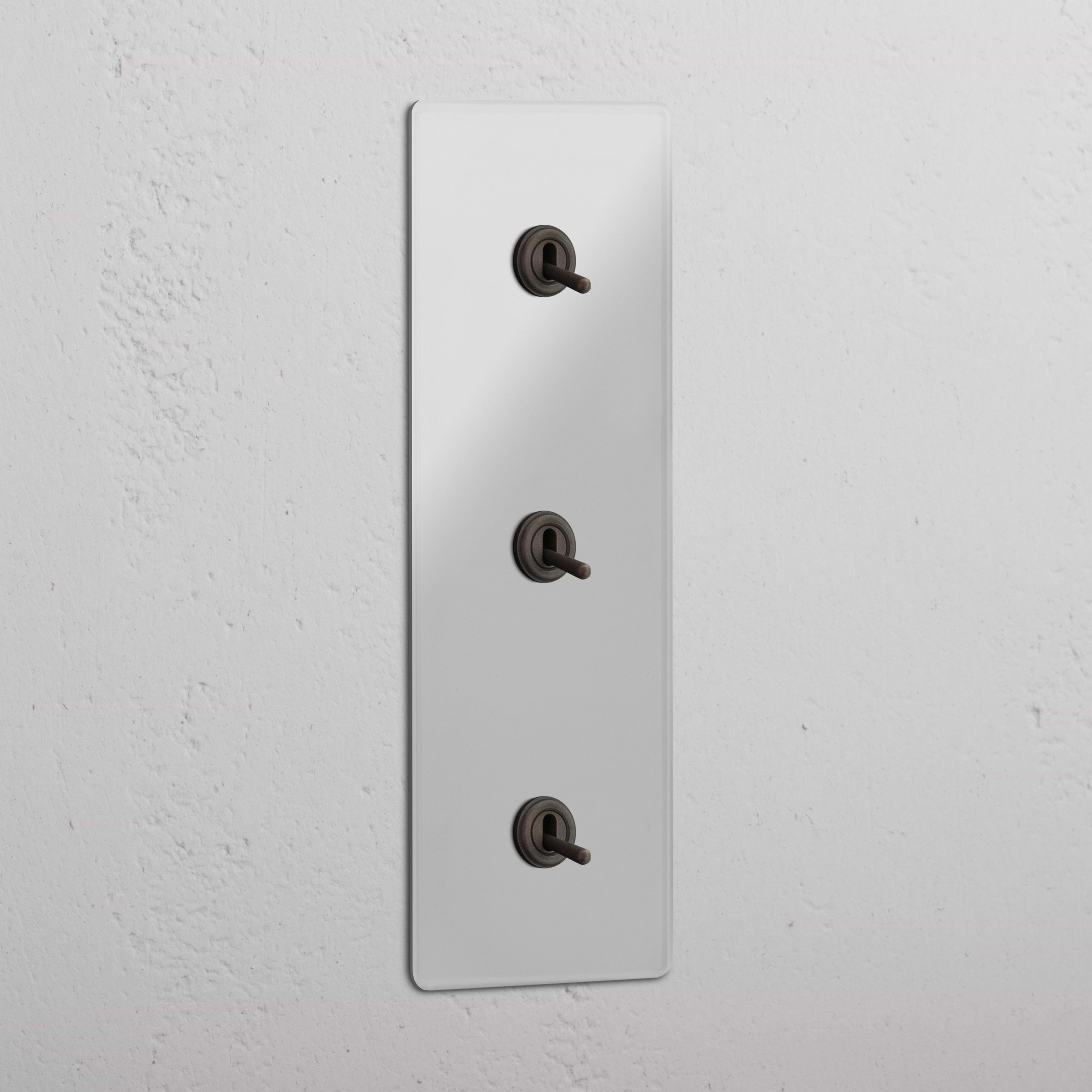 Vertical Triple Toggle Switch in Clear Bronze - User-friendly Light Management System