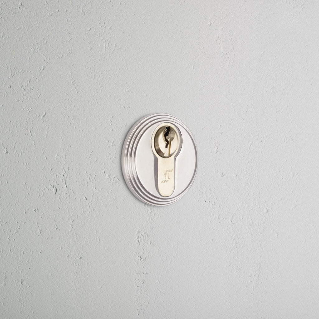 Polished Nickel Warwick Key Escutcheon on White Background