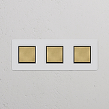 Interruttori a bilanciere tripli in ottone nero anticato, parte della collezione 'Interruttori e Dimmer Tripli'.